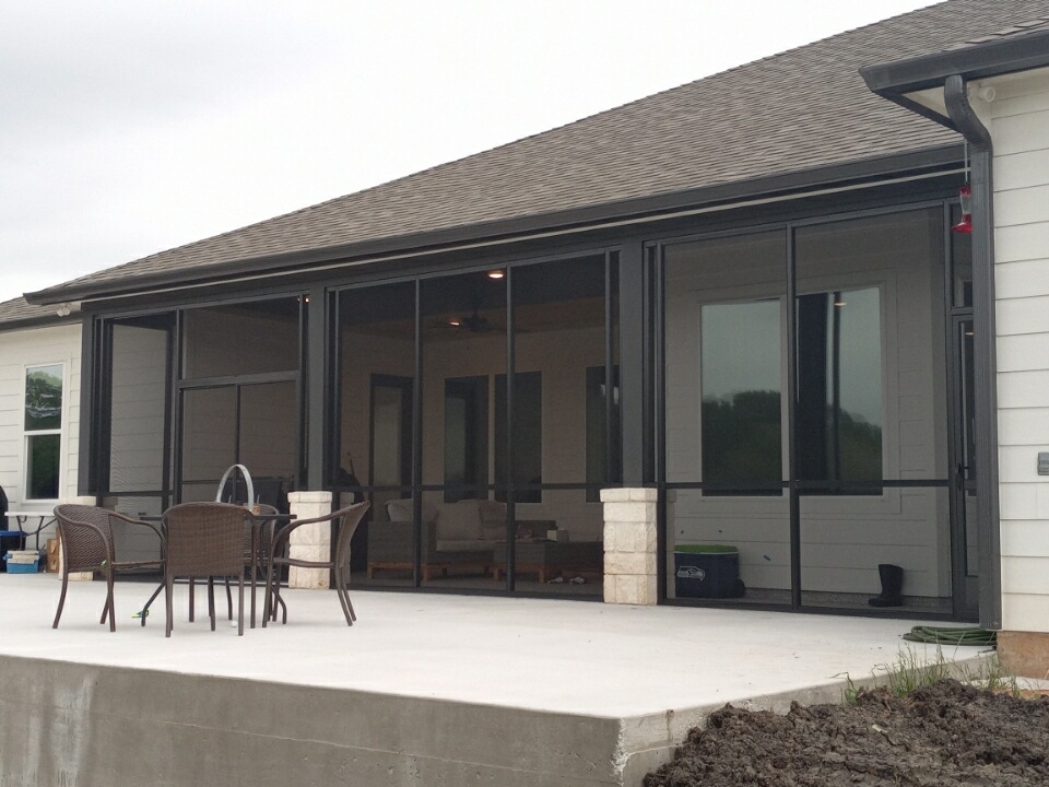 Screened porches in a backyard in Austin TX