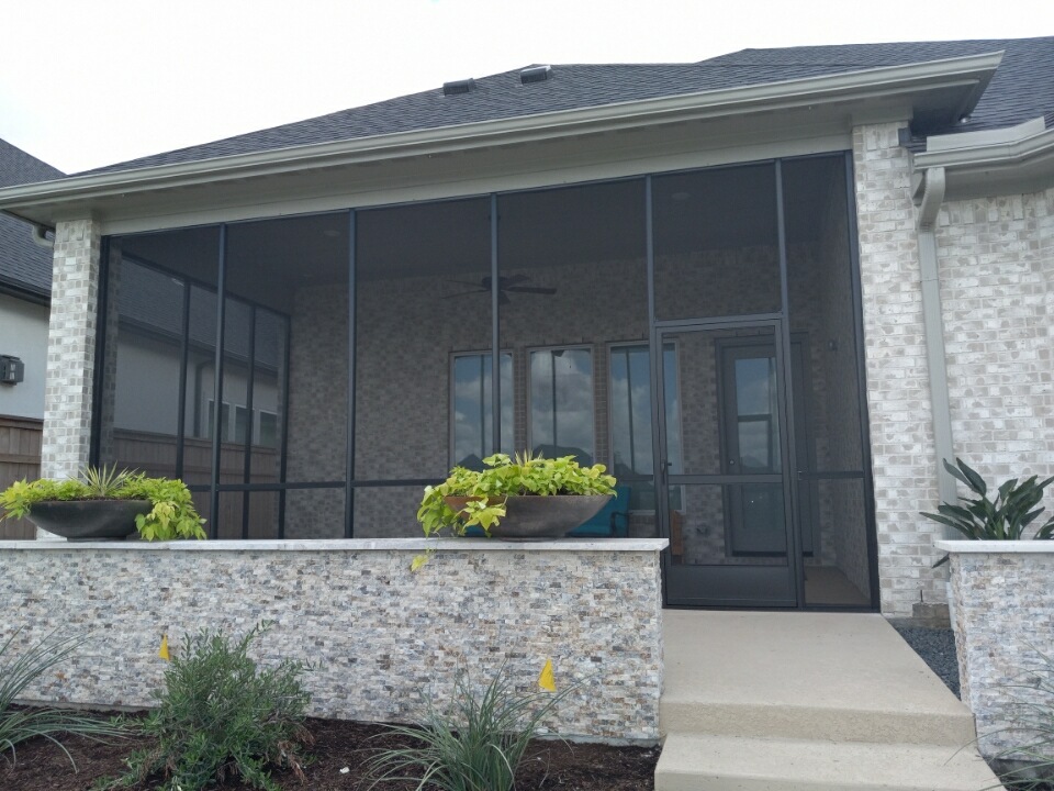 Screened in patio in a backyard in San Antonio TX