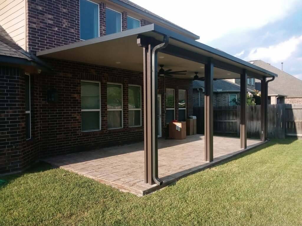 Outdoor Patio Cover Built in Houston, TX with stamped concrete.